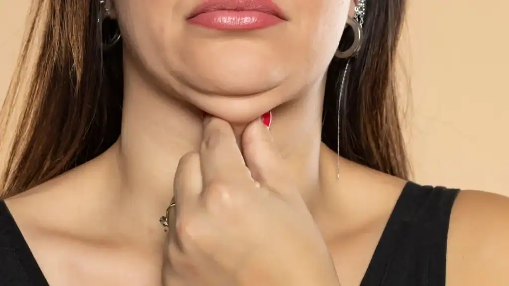 An image of a woman with double chin, sad, worried : Non Surgical Double Chin Removal Treatment in Greenock, UK